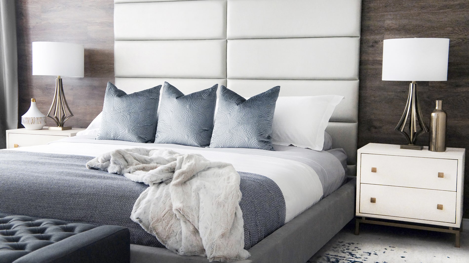In the bedroom design of this Ajax home, the full-height headboard made of vant system panels is another example of a custom look created without spending a lot of money