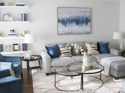 This client is a fan of colour, so we built up rich blue tones through the artwork, pillows and accessories in this living room