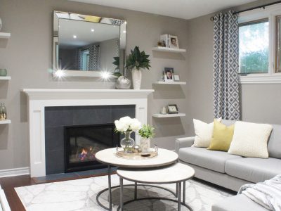 We brought a bit of fun to this Etobicoke living room design with the pattern and texture of the full-length curtains and a pop of yellow with the pillows