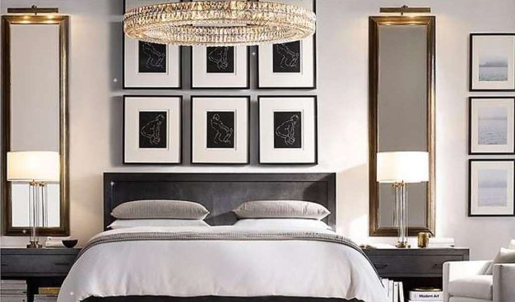 Rows of framed uniform prints create the illusion of a full-height headboard