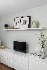 A simple floating shelf with a curated collection of display items