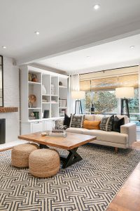 Texture added from the patterned rug and woven ottomans