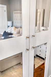 Glass-panelled doors leading into the bedroom