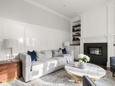 For this family room design, we chose a sectional with durable fabric and added extra seating with the leather ottoman and swivel chairs